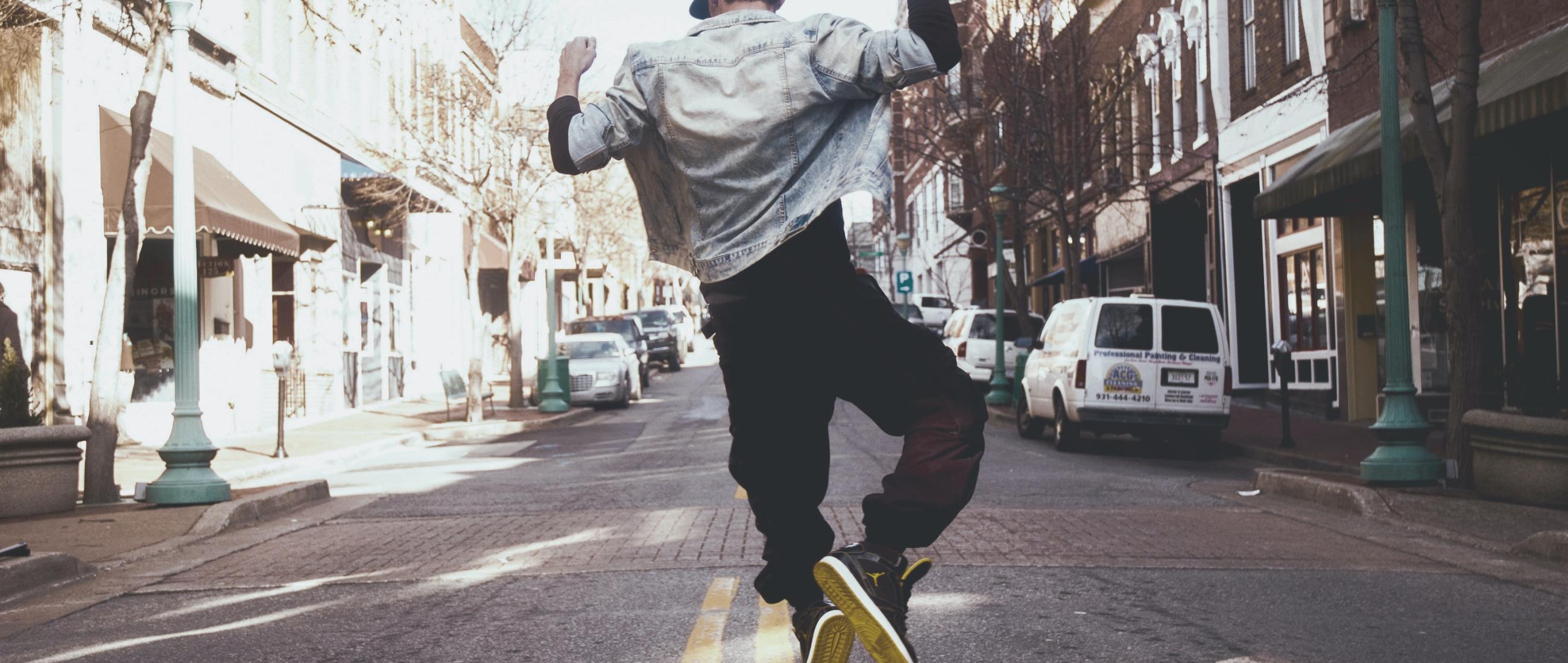 Happy person dancing in a street